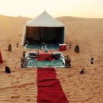 Sunrise over the Arabian Desert with a luxurious 4x4 vehicle on a desert safari adventure. Sunrise Desert Safari